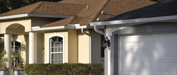 A beautifully painted stucco house showcasing vibrant colors and elegant architectural details